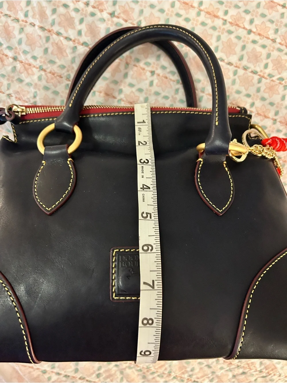 Dooney and Bourke Florentine Satchel 30 in the color Navy. EUC comes w/bag charm